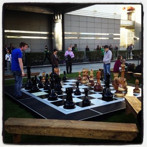 Dreamforce attendees connecting over a giant game of chess