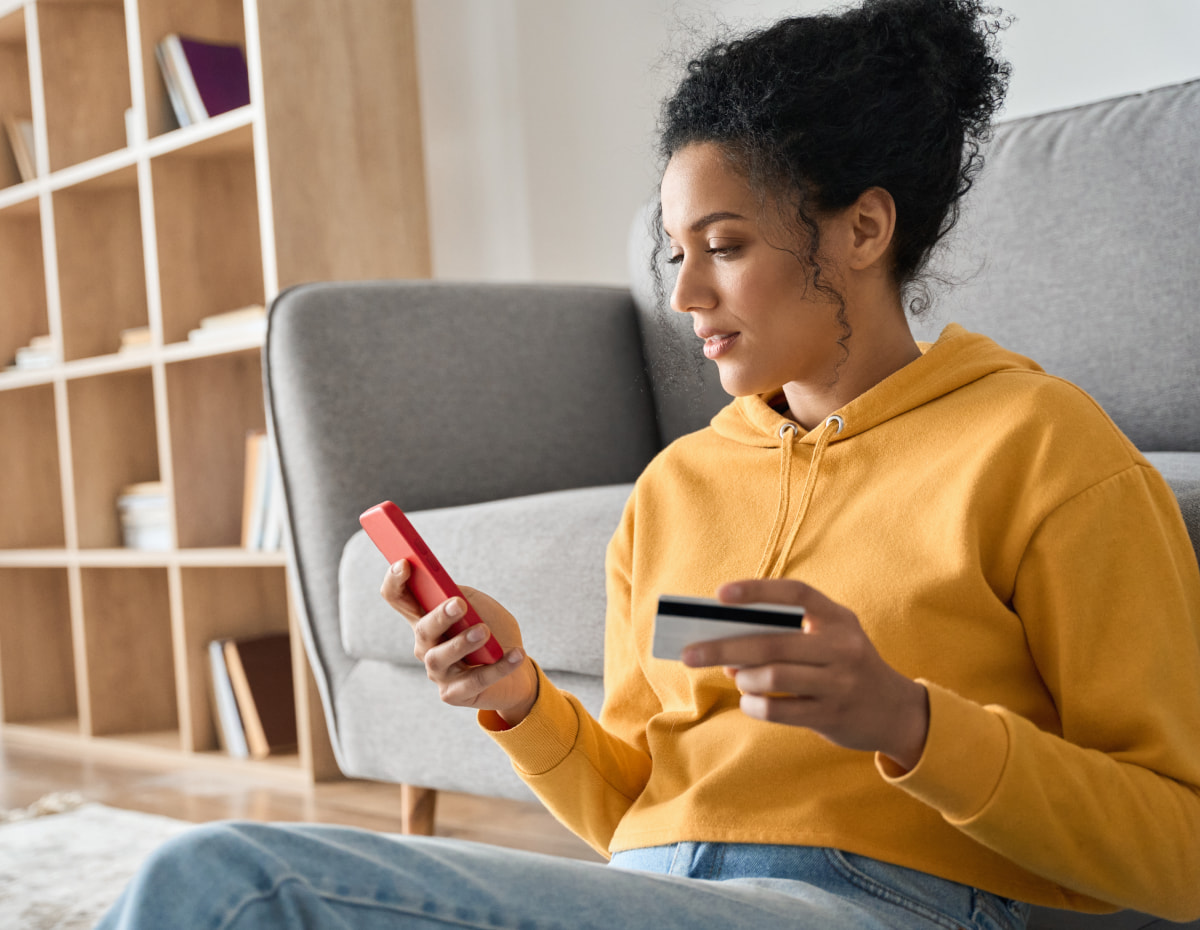 woman making an online e-commerce purchase on her phone