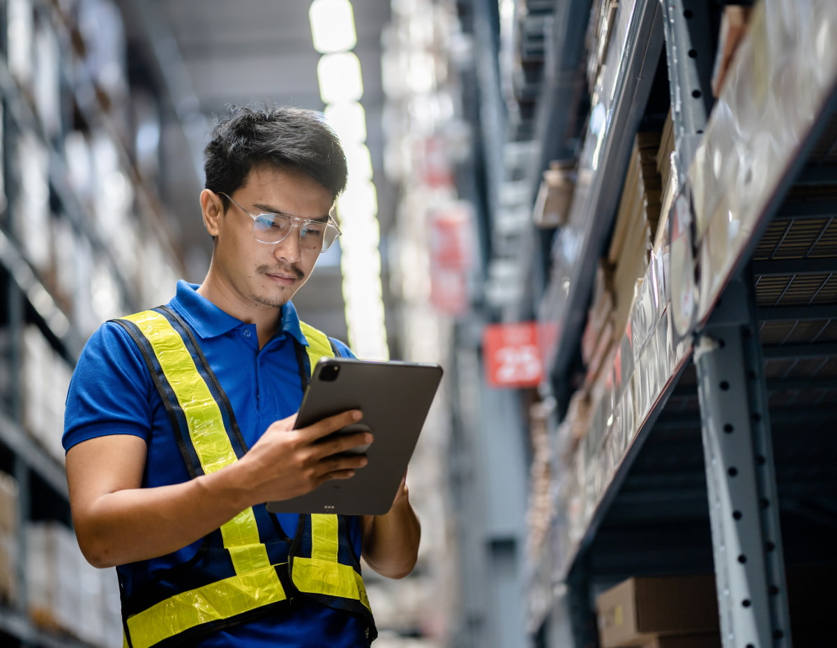 worker managing supply chain in warehouse